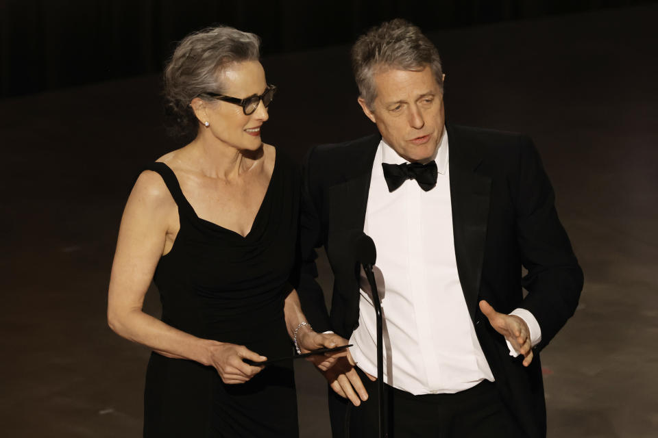 HOLLYWOOD, CALIFORNIA - MARCH 12: (L-R) Andie MacDowell and Hugh Grant speak onstage during the 95th Annual Academy Awards at Dolby Theatre on March 12, 2023 in Hollywood, California. (Photo by Kevin Winter/Getty Images)