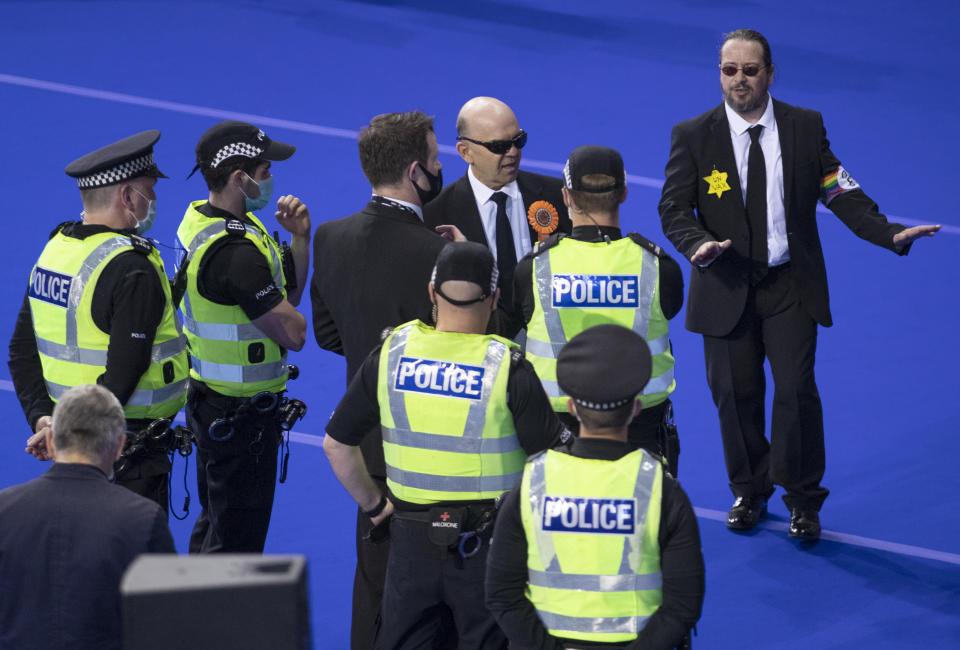 <p>Police speak with members of the Liberal Party before they are removed from the count floor at the Scottish Parliamentary Elections at the Emirates Arena, Glasgow. Picture date: Friday May 7, 2021.</p>
