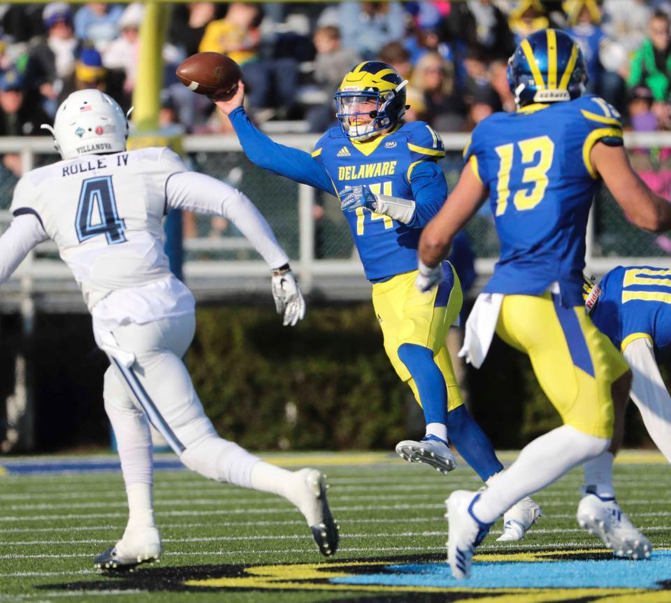 Delaware quarterback Nolan Henderson throws on the move in the third quarter of the Blue Hens' 42-21 loss to Villanova at Delaware Stadium in Nov. 2018.