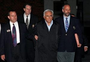 Dominique Strauss-Kahn, head of the International Fund, is led from the Special Victim's Unit police station Sunday, May 15, 2011 in New York. (AP Photo/Craig Ruttle)