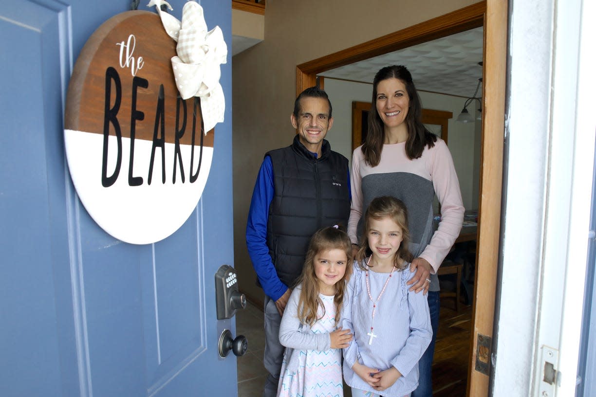 Joe and Hayley Beard pose with their daughters Molly Beard, left, and Elsie Beard on Sunday, March 3, 2022, in the entrance of their Rockton home. Joe Beard is in need of a kidney donor who can also serve as a bone marrow donor.