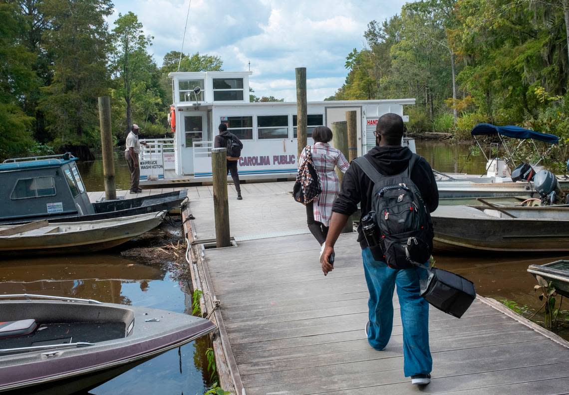 Students walk the dock to the the Sandy Island School Bus Boat for a ride home aboard the “New Prince Washington”. The boat ferries students to and from the Georgetown County mainland for classes. Only a few dozen residents remain on the remote historic island between the Waccamaw and Pee Dee rivers. Sept. 7, 2022.