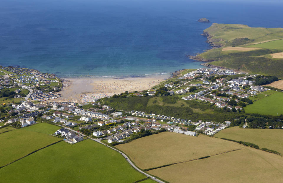 Aerial view of the Cornish coastal resort of Polzeath and Padstow bay