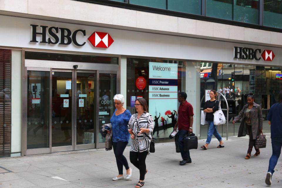 LONDON, UK - JULY 6, 2016: People walk by HSBC Bank branch in London. HSBC was established in Hong Kong in 1865. Currently it is headquartered in the