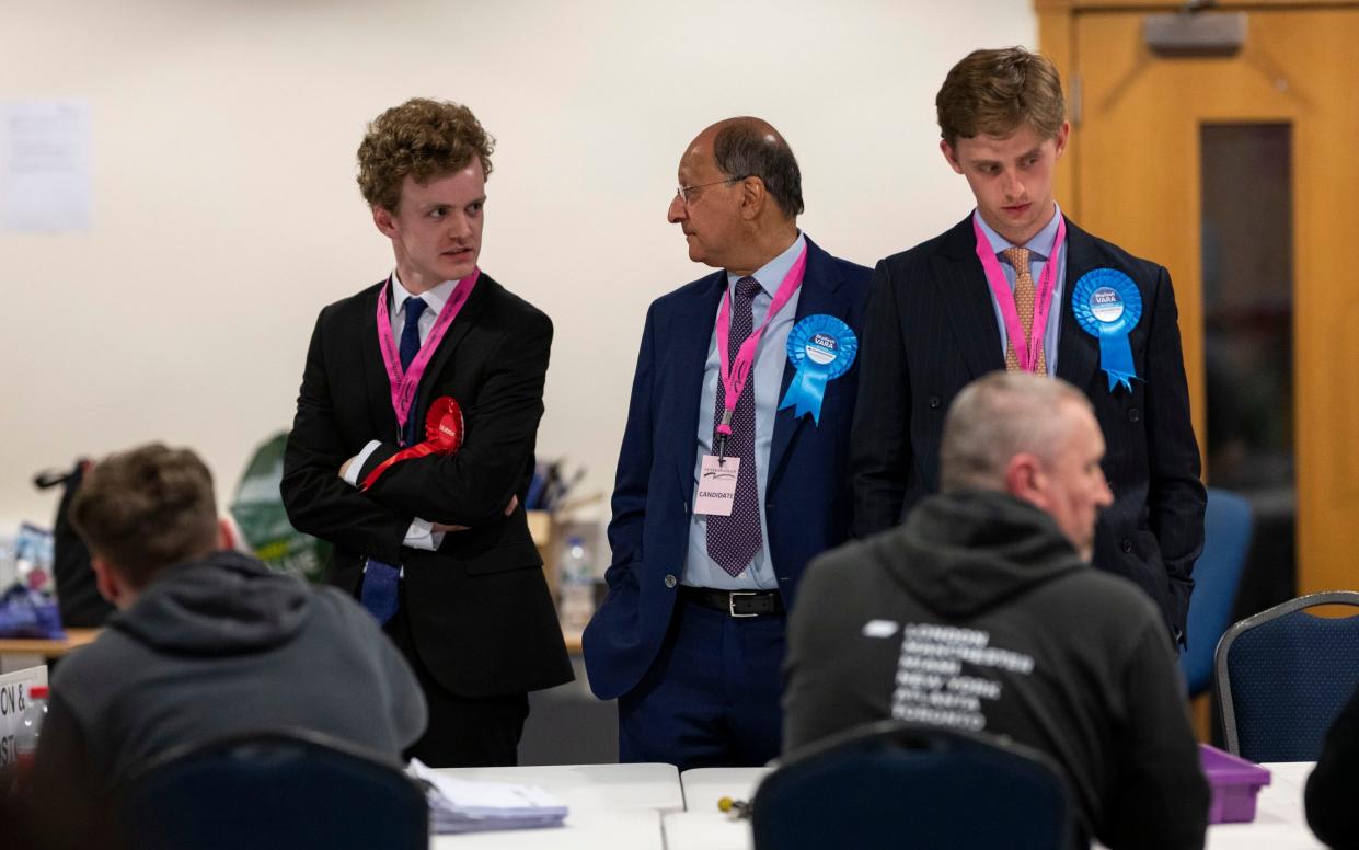 Carling and Vara await the recount at  Peterborough's Kingsgate Conference Centre auditorium