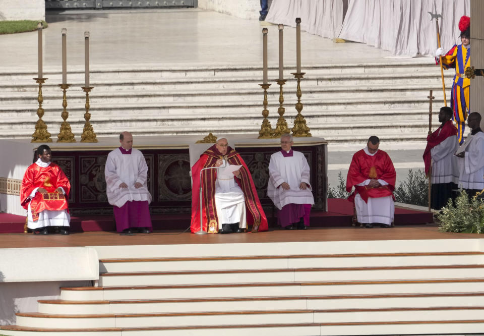 Pope Francis, center, celebrates the Palm Sunday's mass in St. Peter's Square at The Vatican Sunday, April 2, 2023 a day after being discharged from the Agostino Gemelli University Hospital in Rome, where he has been treated for bronchitis, The Vatican said. The Roman Catholic Church enters Holy Week, retracing the story of the crucifixion of Jesus and his resurrection three days later on Easter Sunday. (AP Photo/Andrew Medichini)