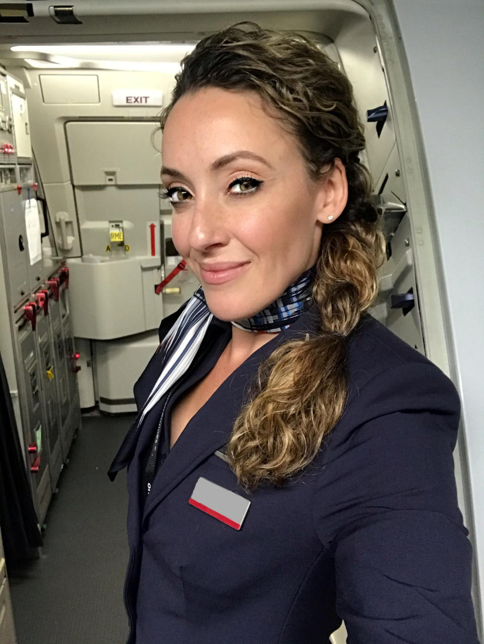 This flight attendant shows off her remarkable acrobatic skills to close the overhead bins with her feet - while wearing high heels. Lindsey O'Brien, 35, gripped onto the armrests before flipping upside down and using her feet to close four luggage containers above. She twirled back down to the aisle and lifted her arms in triumph as her fellow crew members cheered her on. The video was filmed in June aboard an aircraft which had been grounded in her home city of Philadelphia, Pennsylvania, due to Covid-19.