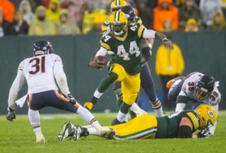 Green Bay Packers running back James Starks (44) rushes with the football as Chicago Bears safety Chris Prosinski (31) defends during the fourth quarter of a NFL game on Thanksgiving at Lambeau Field. Jeff Hanisch-USA TODAY Sports