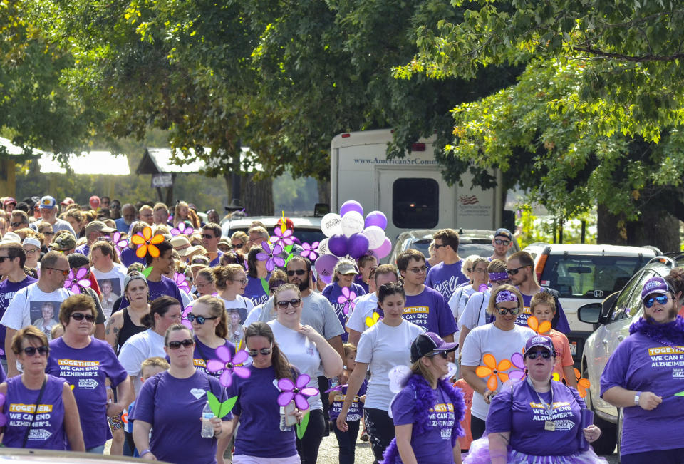 FILE - In this Sept. 16, 2018, file photo, the Walk to End Alzheimer's makes its way through a park in Terre Haute, Ind. The coronavirus pandemic has forced charities or nonprofit groups to cancel or postpone an untold number of walks and runs that raise money for everything from Alzheimer's to Parkinson's. (Austen Leake/Tribune-Star via AP, File)