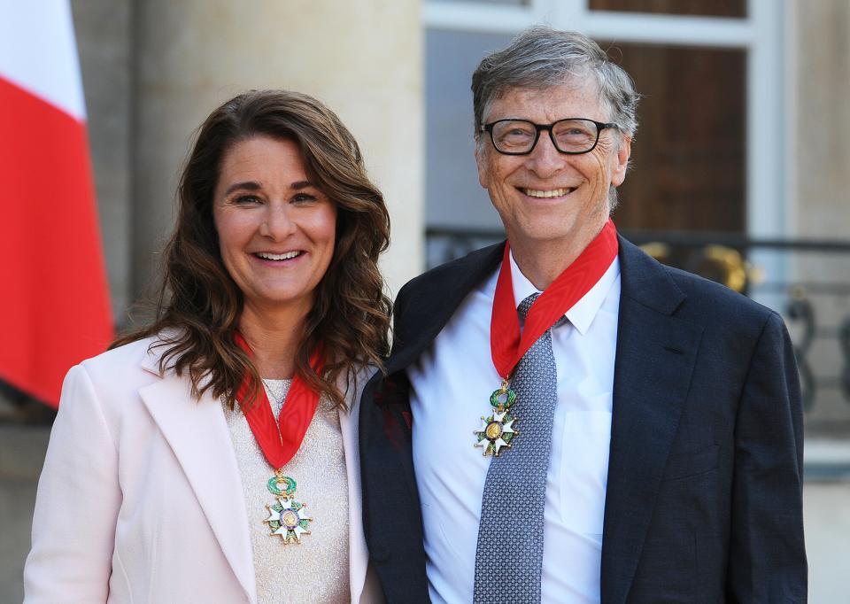 Bill and Melinda Gates pose in front of the Elysee Palace after receiving the award of Commander of the Legion of Honor by French President Francois Hollande on April 21, 2017 in Paris, France