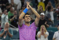 Carlos Alcaraz of Spain celebrates after defeating Lorenzo Musetti of Italy during the Miami Open tennis tournament, Tuesday, March 26, 2024, in Miami Gardens, Fla. (AP Photo/Marta Lavandier)