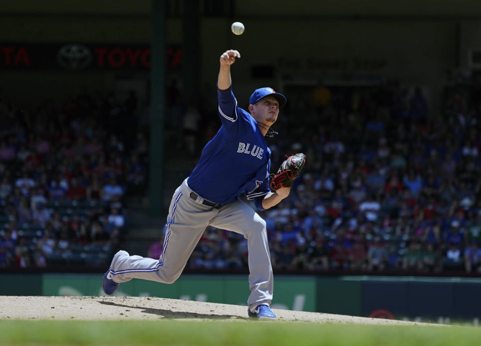 Toronto Blue Jays starting pitcher Clay Buchholz throws a first-inning pitch against the Toronto Blue Jays during a baseball game in Arlington, Texas on Sunday, May 5, 2019. (AP Photo/Louis DeLuca)