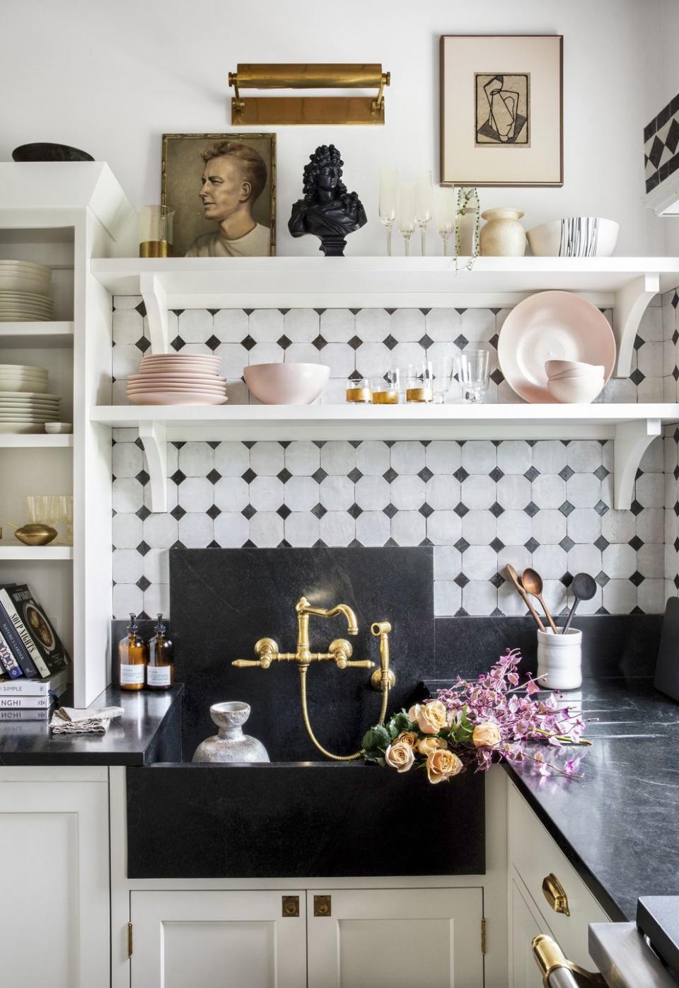 white and black kitchen with white bracket shelves