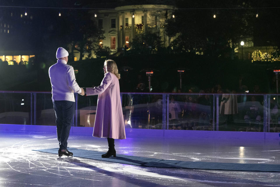 1988 Olympic figure skater Brian Boitano, left, skates next to first lady Jill Biden during the unveiling of the White House Holiday Ice Rink, located at the south panel of the South Lawn of the White House, Wednesday, Nov. 29, 2023, in Washington. (AP Photo/Jacquelyn Martin)