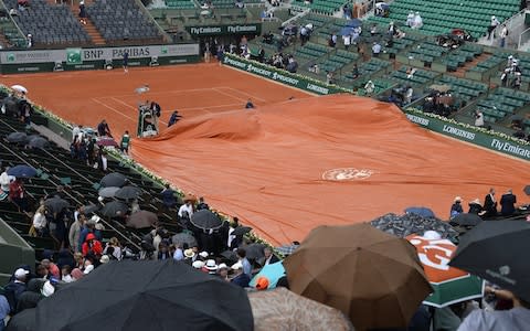 A general view of the Philippe Chatrier court as the rain arrives during the men's singles quaterfinal match between Rafael Nadal of Spain and Diego Schwartzman of Argentina on day 11 of the 2018 French Open at Roland Garros on June 6, 2018 in Paris, France - Credit: Getty Images