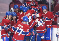 Montreal Canadiens' Jesperi Kotkaniemi (15) celebrates with teammates after scoring against the Toronto Maple Leafs during overtime in Game 6 of an NHL hockey Stanley Cup first-round playoff seres Saturday, May 29, 2021, in Montreal. (Graham Hughes/The Canadian Press via AP)