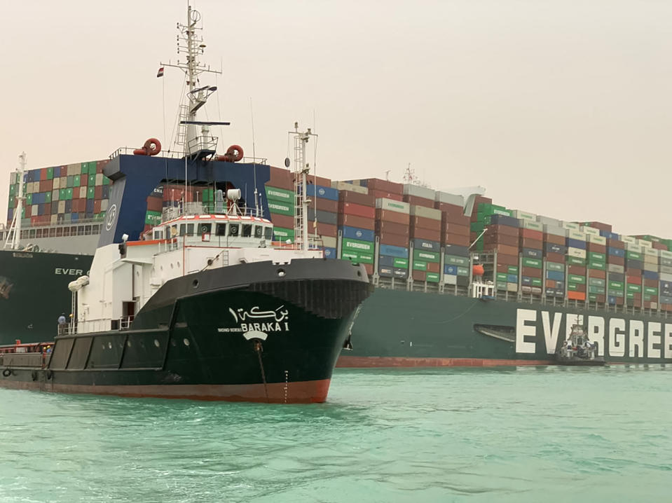 A handout picture released by the Suez Canal Authority on March 24, 2021 shows a part of the Taiwan-owned MV Ever Given (Evergreen), a 400-metre- (1,300-foot-) long and 59-metre wide vessel, lodged sideways and impeding all traffic across the waterway of Egypt's Suez Canal. - A giant container ship ran aground in the Suez Canal after a gust of wind blew it off course, the vessel's operator said on March 24, 2021, bringing marine traffic to a halt along one of the world's busiest trade routes. (Photo by Suez Canal Authority/Handout/AFP via Getty Images)