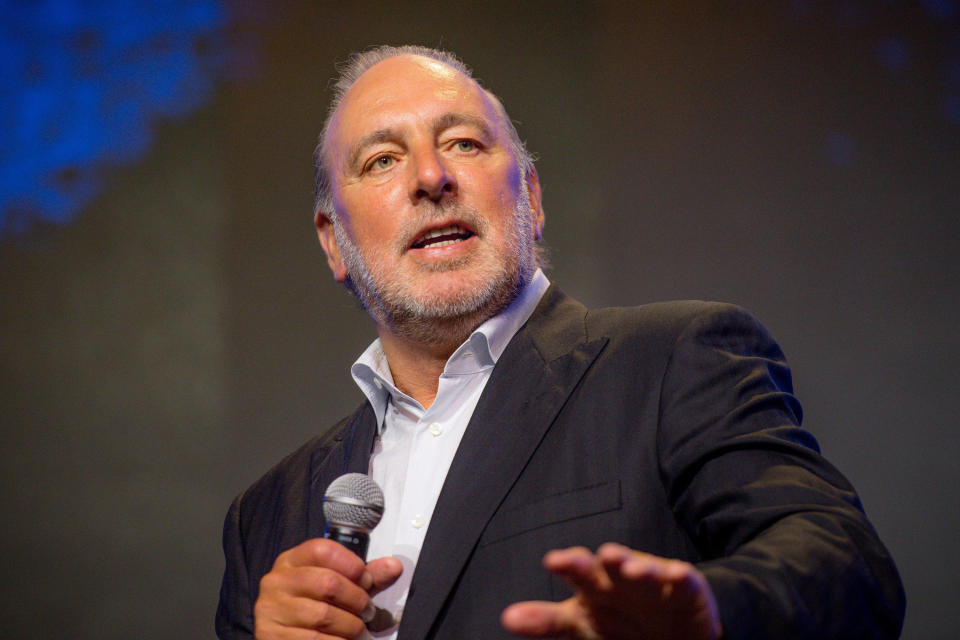 Close-up of Brian Houston with a microphone
