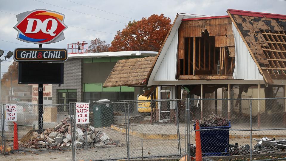 The old Dairy Queen building in Cuyahoga Falls, front, was torn down last week as a replacement building is being built.
