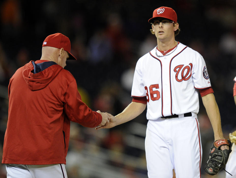 Washington Nationals relief pitcher Tyler Clippard (36) is pulled from the game by Washington Nationals manager Matt Williams, left, during the eighth inning of a baseball game against the Los Angeles Angels, Monday, April 21, 2014, in Washington. The Angels won 4-2. (AP Photo/Nick Wass)