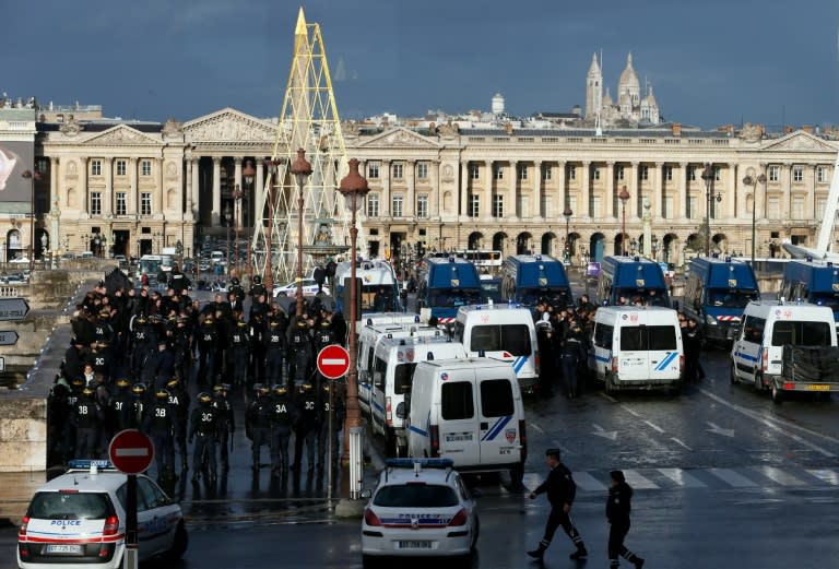 Anti-riot police stand guard on the place de la Concorde, on February 3, 2016 in Paris