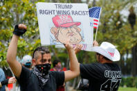 Anti-Trump demonstrators protests outdoors before U.S. Republican presidential candidate Donald Trump speaks at a campaign event in Anaheim, California, U.S., May 25, 2016. REUTERS/Mike Blake