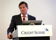 Brady W. Dougan, CEO of Credit Suisse, addresses the full year results conference in Zurich in this February 6, 2014 file photo. REUTERS/Denis Balibouse/Files