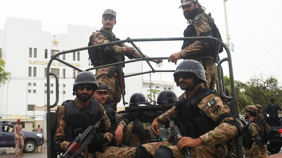 Soldiers, pictured here fully armed on the way to the ground in Karachi.