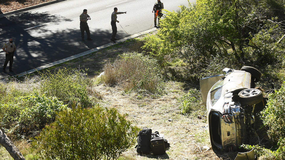 LA County Sheriff's officers, pictured here investigating an accident involving Tiger Woods.