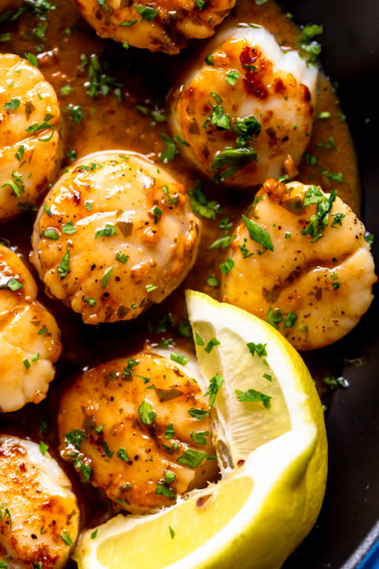 <p>Sweet, buttery and delicate sea scallops are quickly seared in a hot pan, then a simple lemon, butter and garlic sauce is made in the same pan. Served on their own or over pasta, these seared scallops are perfect for date night at home.</p><p><strong>Get the recipe: <a href="https://www.foxandbriar.com/lemon-butter-scallops-recipe/" rel="nofollow noopener" target="_blank" data-ylk="slk:Lemon Butter Scallops;elm:context_link;itc:0;sec:content-canvas" class="link ">Lemon Butter Scallops</a></strong></p>