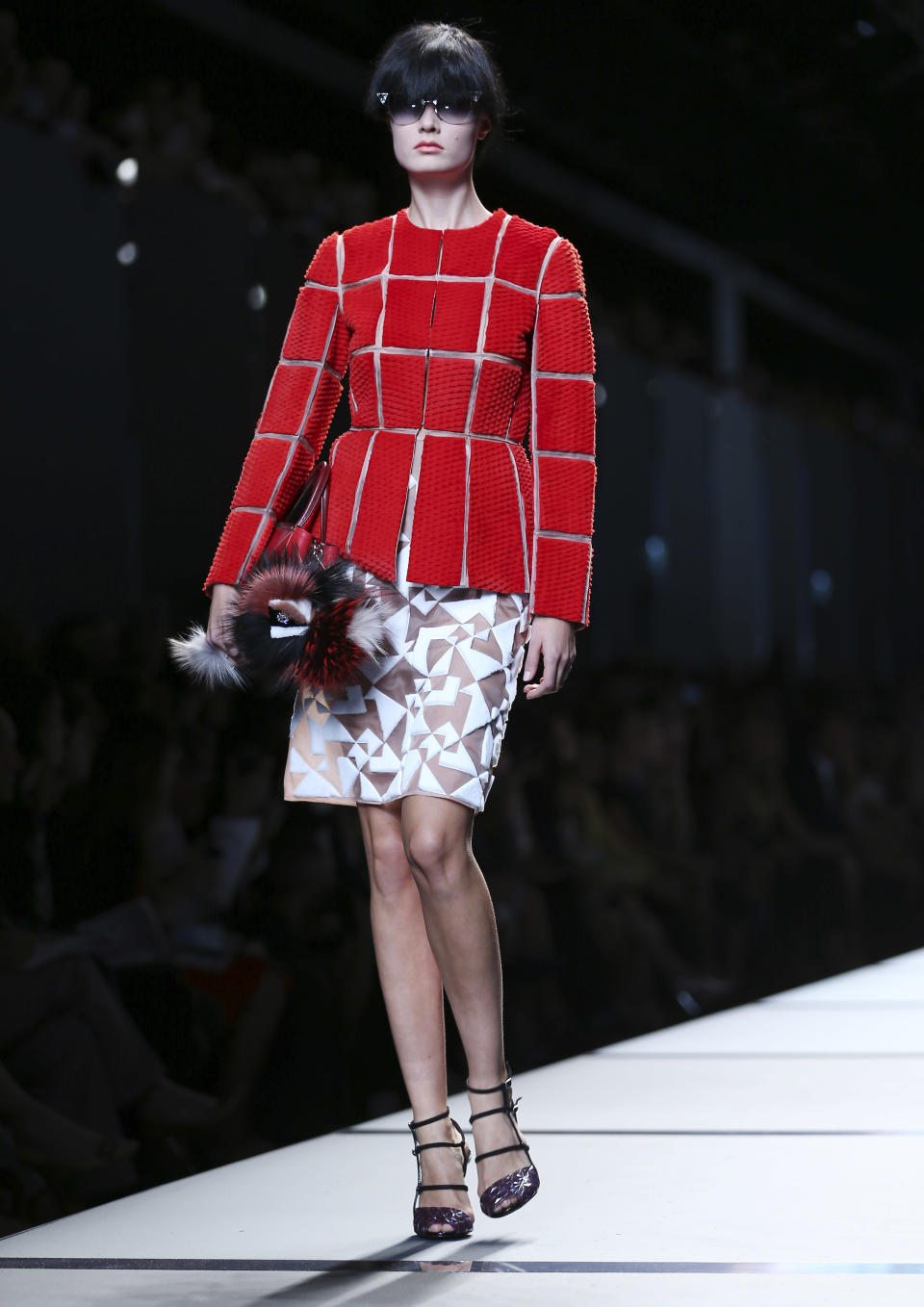 A model wears a creation for Fendi women's Spring-Summer 2014 collection, part of the Milan Fashion Week, unveiled in Milan, Italy, Thursday, Sept. 19, 2013. (AP Photo/Antonio Calanni)