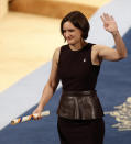 FILE - In this Friday Oct. 23, 2015 file photo, Esther Duflo of France waves after receiving the Princess of Asturias award for Social Sciences from Spain's King Felipe VI at a ceremony in Oviedo, northern Spain. The 2019 Nobel prize in economics has been awarded to Abhijit Banerjee, Esther Duflo and Michael Kremer "for their experimental approach to alleviating global poverty." The Royal Swedish Academy of Sciences announced the prize on Monday Oct. 14, 2019. (AP Photo/Jose Vicente, File)