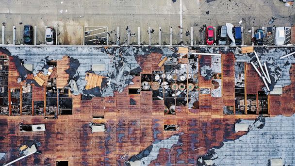 PHOTO: An aerial view of roof damage after a rare confirmed tornado touched down and ripped up building roofs in a Los Angeles suburb of Montebello, March 22, 2023. (Mario Tama/Getty Images)