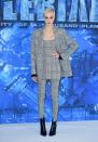 <p>Delevingne went down the masculine route, wearing a checked three-piece suit by Alexander Wang. Studded black boots finished off the striking ensemble. (Photo: PA) </p>