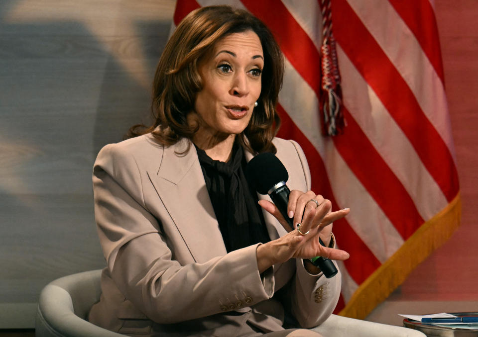 Vice President Kamala Harris speaks on stage.