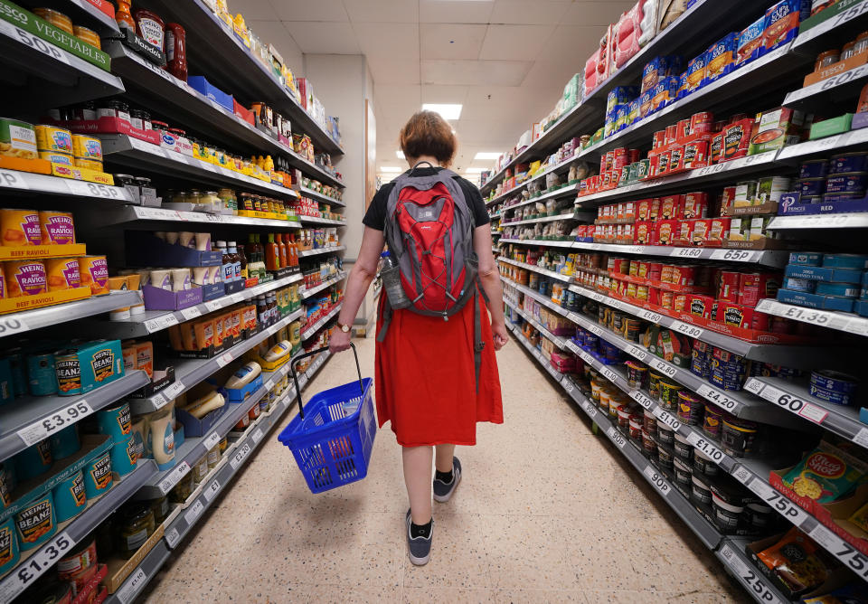 A shopper walking through the aisle of a Tesco supermarket in London. Picture date: Saturday September 3, 2022. (Photo by Yui Mok/PA Images via Getty Images)