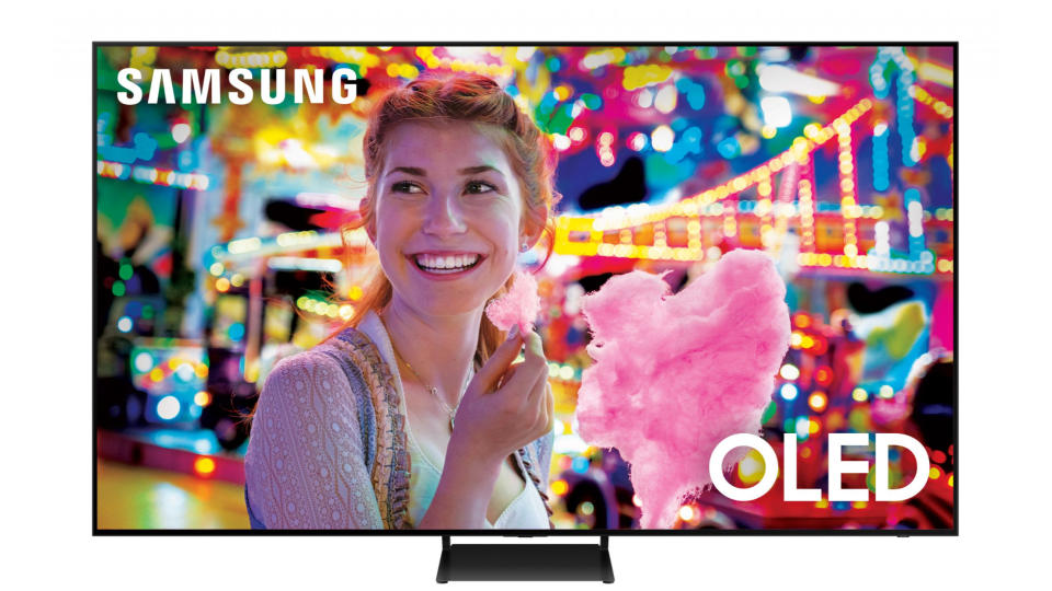Samsung S90C on a white background, showing a woman eating candyfloss