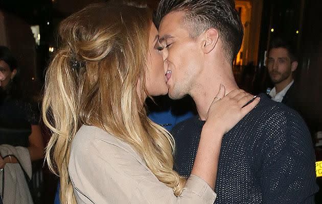 Gaz plants a wet one on his fellow 'Geordie Shore' cast mate Charlotte Crosby. Source: SPLASH