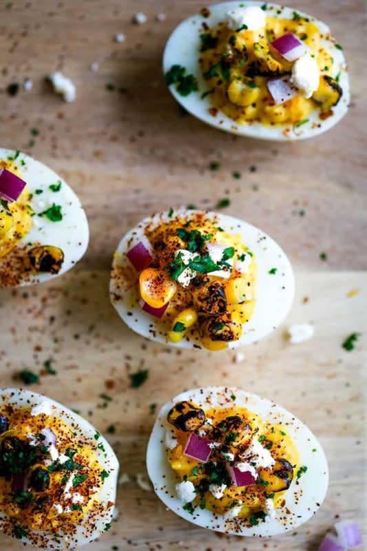 <p>Melanie Makes</p><p>Mexican street corn deviled eggs are guaranteed to be the talk of your next gathering. All of the toppings create one amazing bite-size appetizer!</p><p><strong>Get the recipe: <a href="https://melaniemakes.com/mexican-street-corn-deviled-eggs/" rel="nofollow noopener" target="_blank" data-ylk="slk:Mexican Street Corn Deviled Eggs;elm:context_link;itc:0;sec:content-canvas" class="link ">Mexican Street Corn Deviled Eggs</a></strong></p><p><strong>Related: <a href="https://www.yahoo.com/lifestyle/42-easy-mexican-crock-pot-224705152.html" data-ylk="slk:40 Crock Pot Mexican Recipes;elm:context_link;itc:0;sec:content-canvas;outcm:mb_qualified_link;_E:mb_qualified_link;ct:story;" class="link  yahoo-link">40 Crock Pot Mexican Recipes</a></strong></p>