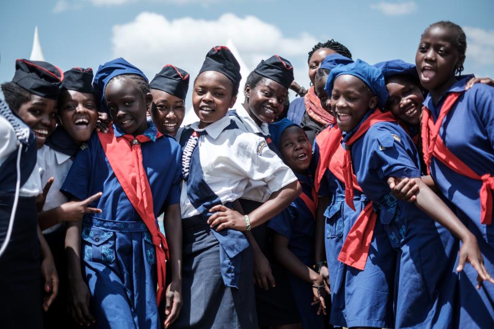 Members of Kenya Girl Guides take photos after attending a ceremony&nbsp;to mark International Women's Day.