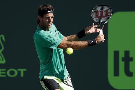 Mar 27, 2017; Miami, FL, USA; Juan Martin del Potro of Argentina hits a backhand against Roger Federer of Switzerland (not pictured) on day seven of the 2017 Miami Open at Crandon Park Tennis Center. Federer won 6-3, 6-4. Mandatory Credit: Geoff Burke-USA TODAY Sports