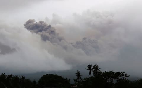 Dark pyroclastic ash rises into the sky - Credit: APTN