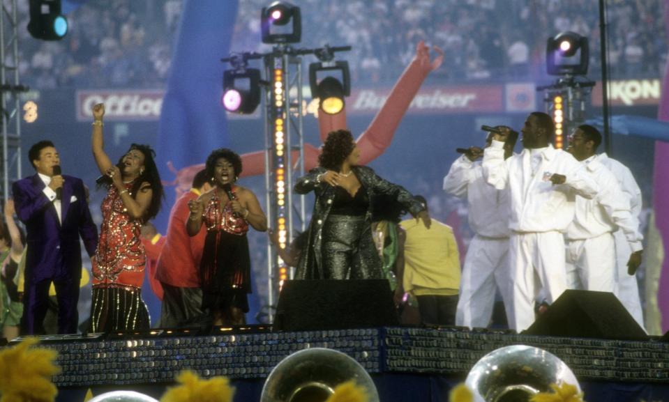 Queen Latifah ( aka Dana Owens), Smokey Robinson, Martha Reeves and Boyz II Men perform at The Halftime Show, "A Tribute To Motown's 40th Anniversary"
