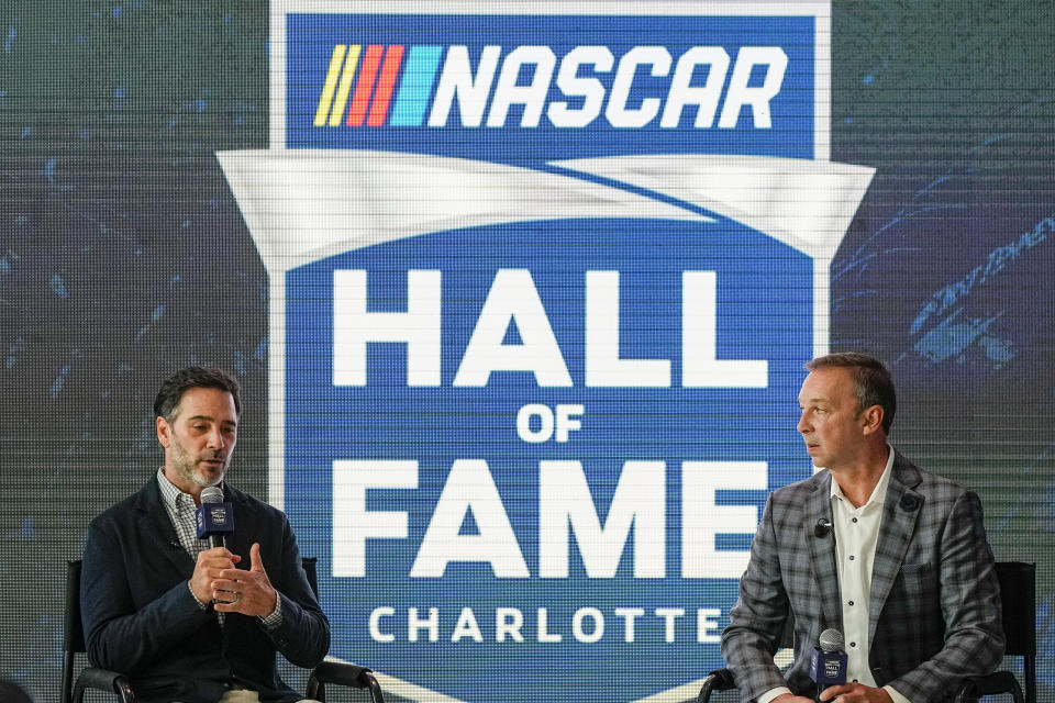 FILE - Jimmie Johnson, left, and his former crew chief Chad Knaus, who combined to win a record-tying seven Cup Series championships, speak during a news conference after they were selected into the NASCAR Hall of Fame on Wednesday, Aug. 2, 2023, in Charlotte, N.C. Jimmie Johnson and Chad Knaus were paired at Hendrick Motorsports in late 2001 as two unproven racers that team owner Rick Hendrick believed could be successful together in NASCAR’s top series. Their success was immediate and unstoppable as the duo won a record-tying seven Cup titles that included an unprecedented five in a row. (AP Photo/Chris Carlson, File)