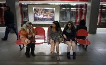 Passengers without their pants talk to a woman as they wait for a train during the "No Pants Subway Ride" event at a subway station in Sofia January 12, 2014. The event is an annual flash mob and occurs in different cities around the world, according to its organisers. REUTERS/Stoyan Nenov (BULGARIA - Tags: SOCIETY ENTERTAINMENT TPX IMAGES OF THE DAY)