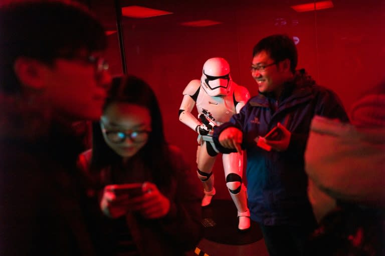 People queue for the premiere of 'Star Wars: The Force Awakens' in Beijing, on January 8, 2016