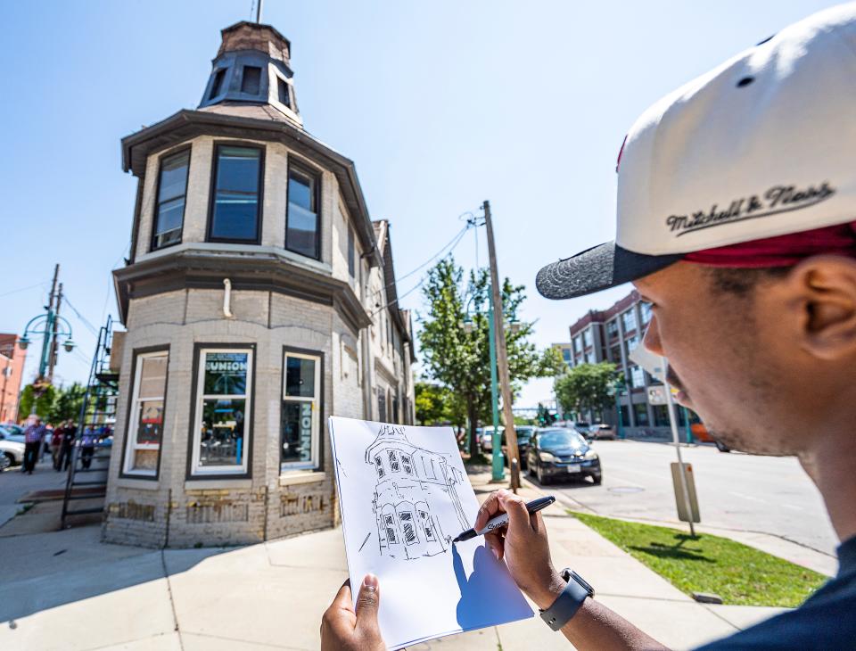 MIAD Product Design student Roger Bryant draws a sketch of a former tavern that was also used as MIAD's student union, owners want to demolish it for redevelopment while historic preservation folks argue it has value and should be saved, on Wednesday August 16, 2023 in Milwaukee, Wis. 



Jovanny Hernandez / Milwaukee Journal Sentinel