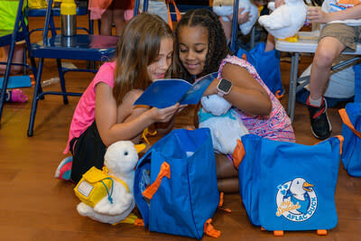 Children receive their My Special Aflac Duck, a comforting robotic companion and hallmark of Aflac's philanthropic mission supporting pediatric cancer and sickle cell programs and initiatives. Aflac launched new resources during September, Childhood Cancer and Sickle Cell Awareness Month, visit Aflac.com/BridgeToBrighter to learn more.