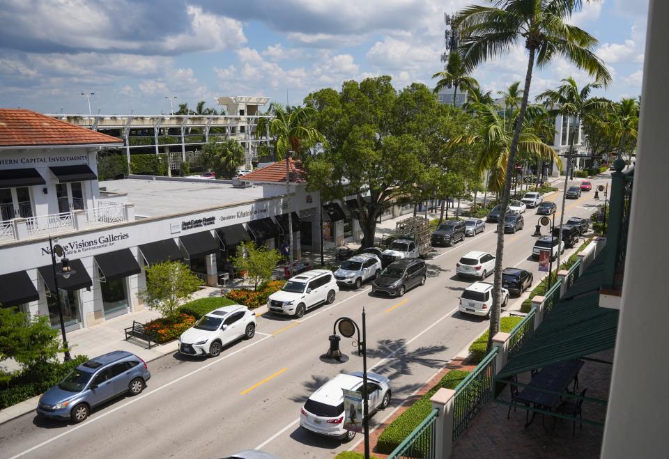 Cars travel along Fifth Avenue South in Naples on Thursday, Sept. 7, 2023.