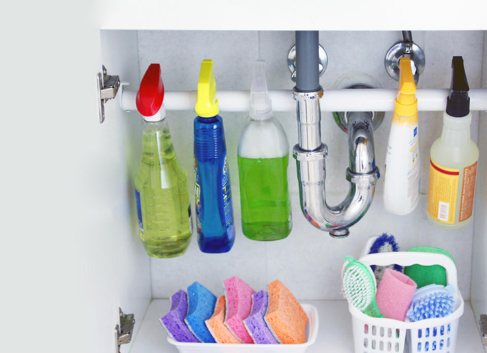 <body> <p>Rescue your under-sink cabinet from clutter by enlisting help from a bathroom basic. Secure a <a rel="nofollow noopener" href=" http://www.bobvila.com/slideshow/8-notorious-closet-problems-solved-48531?bv=yahoo" target="_blank" data-ylk="slk:tension rod;elm:context_link;itc:0;sec:content-canvas" class="link ">tension rod</a> to the sidewalls of the cabinet to create hanging space for any cleanser that comes in a spray bottle. With the floor of the cabinet clear, you'll have plenty of room to stash baskets filled with brushes and sponges and other cleaning staples.</p> <p><strong>Related: <a rel="nofollow noopener" href=" http://www.bobvila.com/slideshow/how-to-clean-your-cleaning-tools-48385?bv=yahoo" target="_blank" data-ylk="slk:How To: Clean Your Cleaning Tools;elm:context_link;itc:0;sec:content-canvas" class="link ">How To: Clean Your Cleaning Tools</a> </strong> </p> </body>